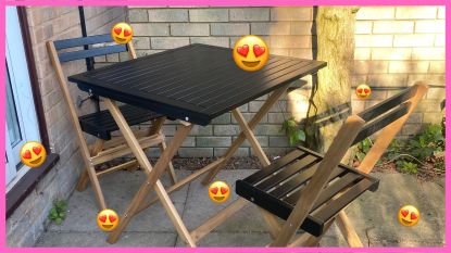 La Redoute black bistro set in Annie's garden, unfolded with heart eye emojis on photo and pink border